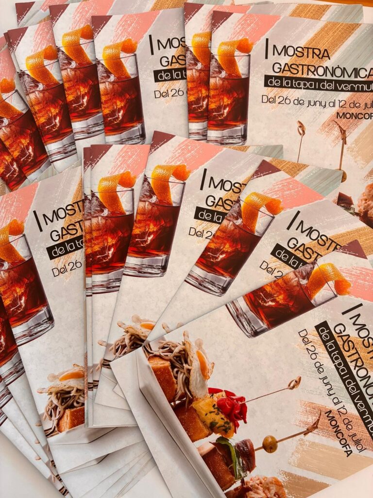 Promotional flyers for a tapas and vermouth festival, showing a glass with vermouth and orange peel plus food images; text reads 'Mostra Gastronómica de la tapa y del vermut' and dates.